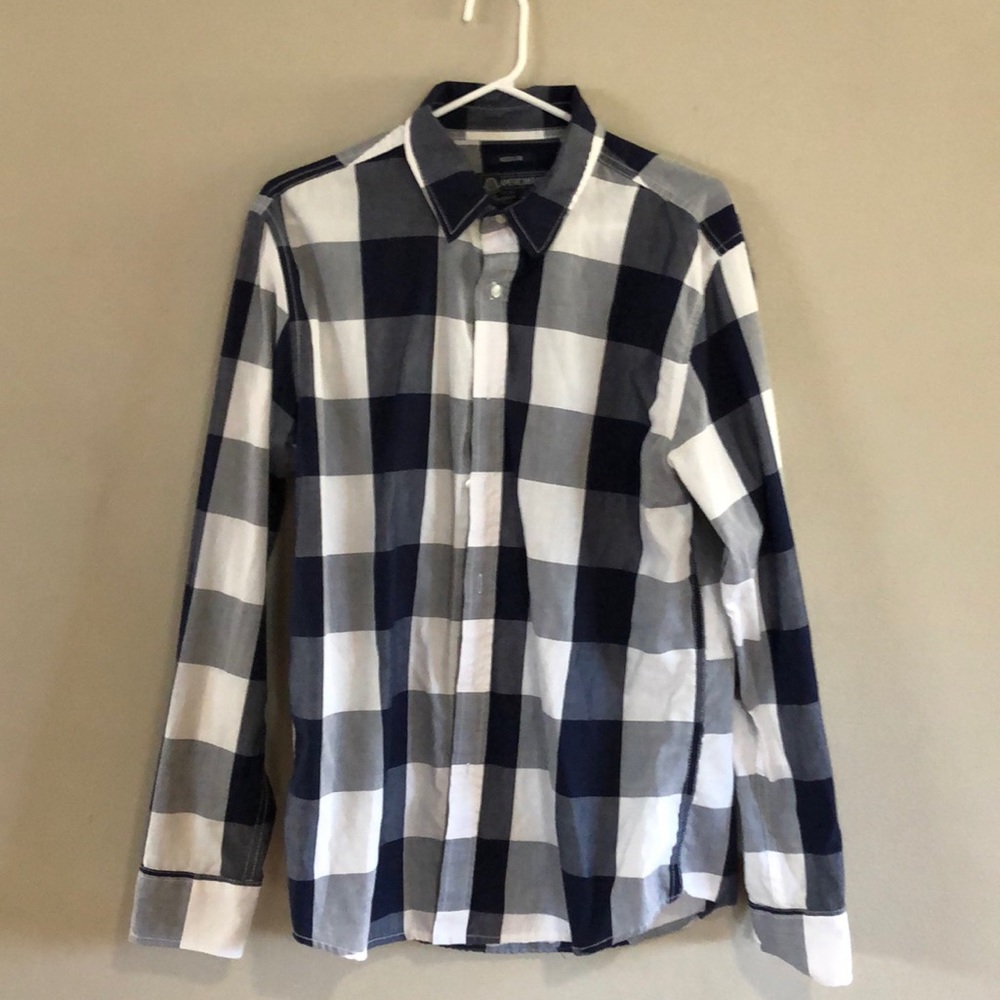 Long sleeve blue dress shirt.